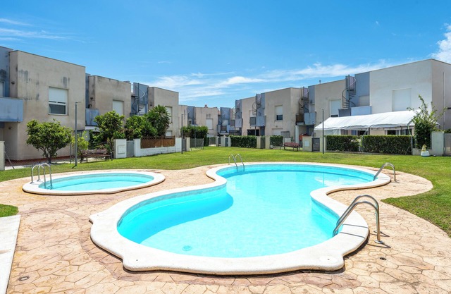 Casa de vacaciones 'Mar Azul' con piscina compartida, Wi-Fi y aire acondicionado