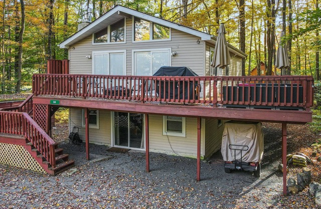 Home with a fireplace, gym, tennis, pool, beach access, game room & washer/dryer