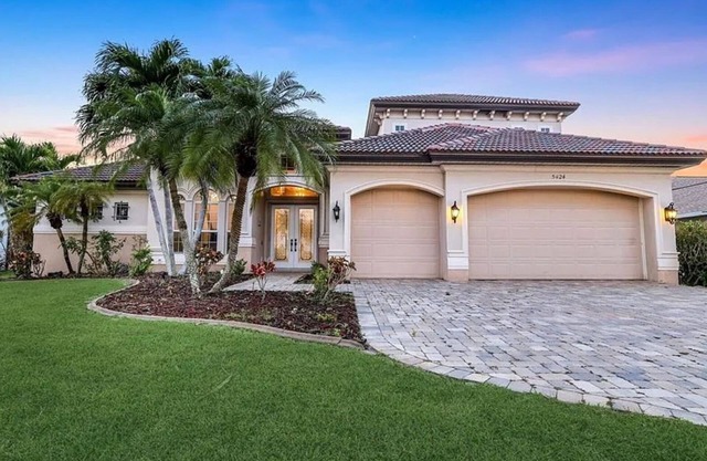 Luxury Cape Harbour Canal 4 Bedroom Pool Home on the Water Minutes to Night Life