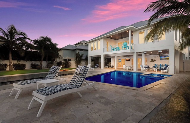 Luxury Canalfront Retreat with Dock, Pool, Spa and Game Room