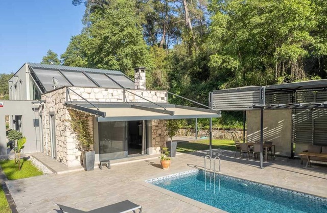 Stylish villa nearby the river and surrounded by pine forest.