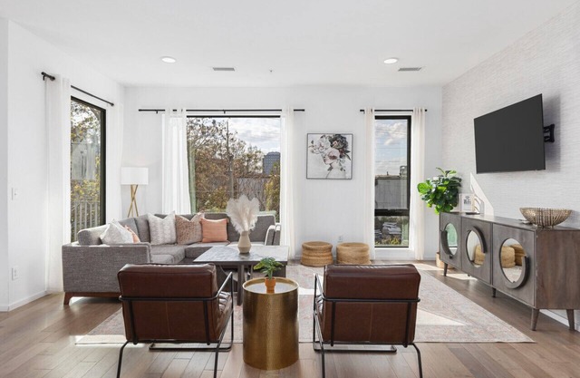 Luxury on the River - Walk to Downtown, 2 Private Patios & Garage Parking