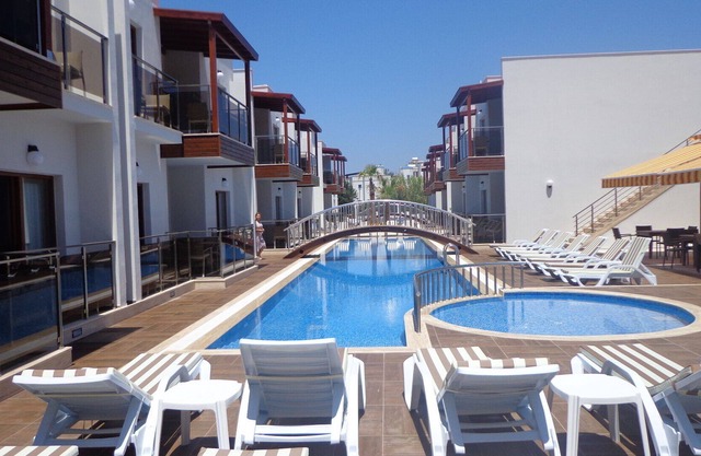 Apartamento de vacaciones de lujo de 1 dormitorio con piscina comunitaria.