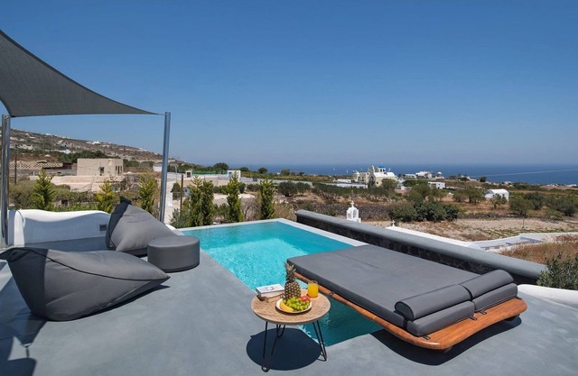 Masterful Santorini Villa | Villa Zacharias | 4 Bedrooms | Outdoor Dining Area | Private Outdoor Pools | Private Hot Tubs | Fira