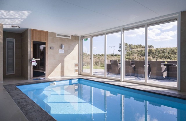 Modern and luxurious holiday home with private indoor swimming pool and wellness