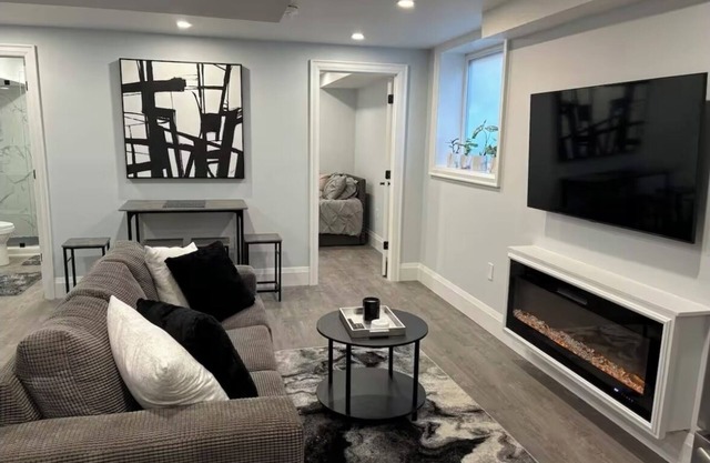 New Modern bright two bedroom lower level duplex with salt water pool!