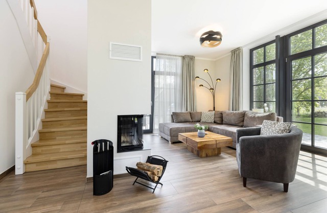 Modern thatched roof house "Haus Meeresuchten" with fireplace and sauna near the beach