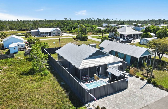 NEW LISTING! Special Shell features 2BD/2BA w/private, fenced yard, swim spa, outdoor fireplace!