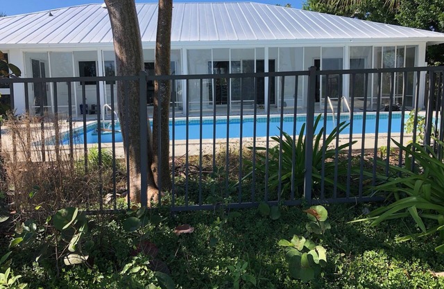 Newly renovated 2024. Located on golf course with a lake view and pool.