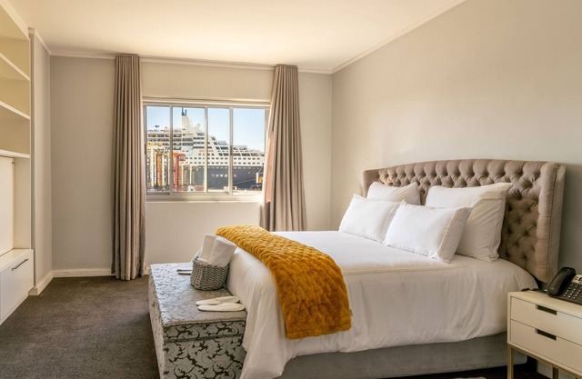 Opening into a balcony with garden views, the air-conditioned 2bedroom apartment