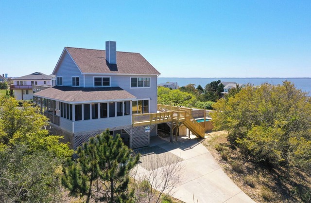 Pet-friendly oceanside Duck home w/ pool, hot tub, sound and sunset views!