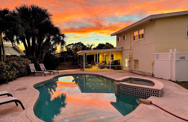 Private heated pool home with hot tub near beach, sleeps 10