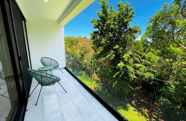 Modern Condo Jungle Retreat w/ Pool Near the Beach