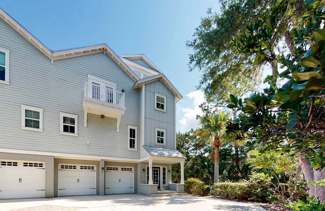 Riverfront, dog-friendly townhome with fireplace, balcony & shared dock