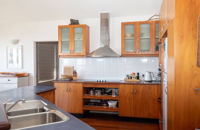 Set high with sweeping ocean views to Moreton Island and Cylinder Beach.