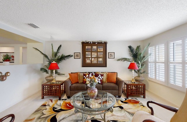 Spacious home with sunroom, patio, fireplace, & water views