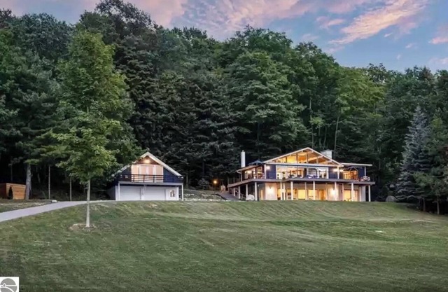 Spectacular view of Lake Michigan on wooded 37 acres access to beautiful beach
