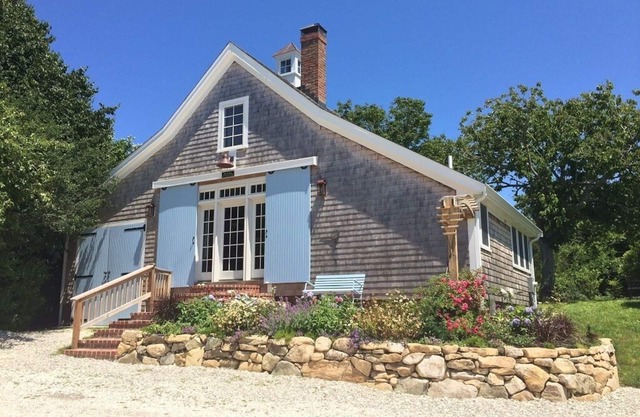 Step back in time in this beautifully maintained antique horse barn cottage!!