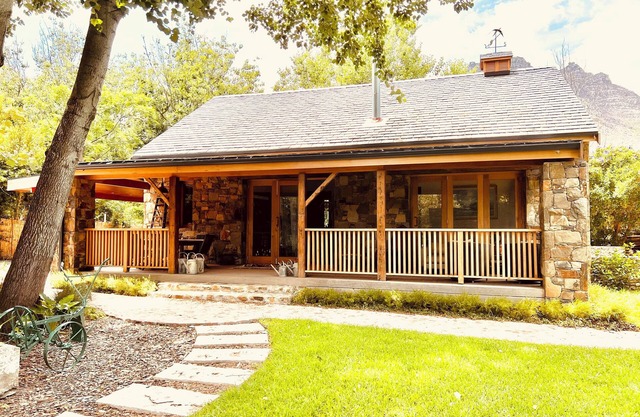 STONE MAISON Luxury stone cottage set in tranquil gardens.