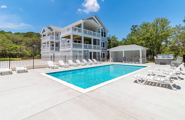 Stunning 14BR oceanside Corolla home w/ pool, hot tub, rec area w/ pub, & more!