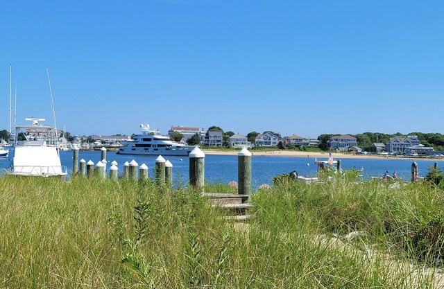 Stunning waterfront with sandy beach & dock walking distance to top restaurants!