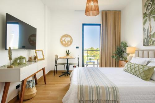 Stylish Downtown Punta Cana Studios - Balcony, Pool, and Gym Near Top Attractions