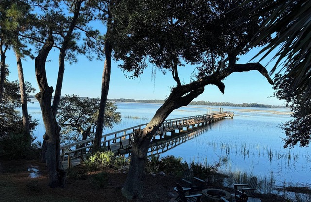 Sunset views from the dock Luxury 3 BR plus Carriage House on gated Callawassie