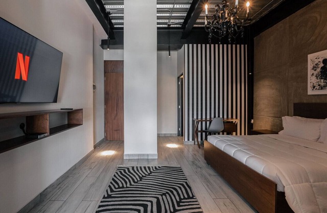 The Striped Loft 6 – Elegancia Moderna en ubicación centrica con cocina