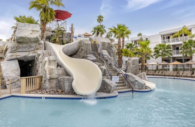 Three Spacious 2BR Suite w/ Balcony | Kitchen + Living Area | 2 Swimming Pools