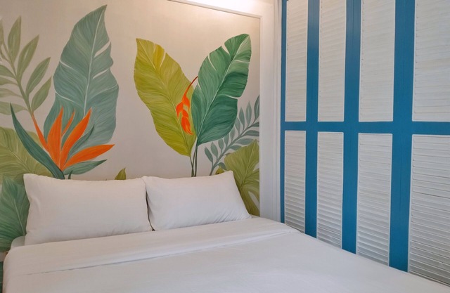 Two separate studio units on the same floor of a midrise condominium building.