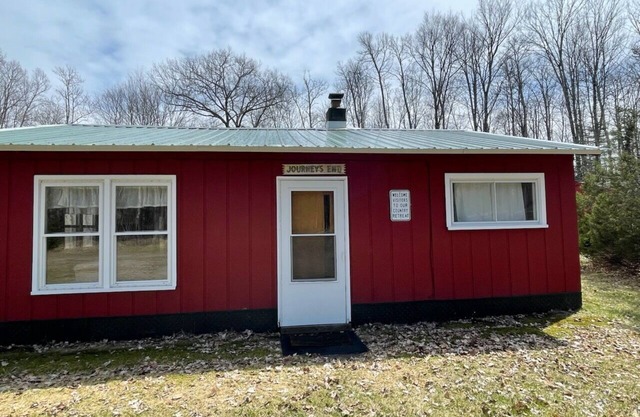 Unplug from it all at a lovely 2-bedroom cabin nestled in the woods!