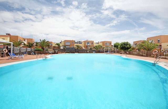 Casa de vacaciones "Las Fuentes Corralejo" con vistas a la montaña, piscina compartida y Wi-Fi