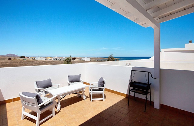 Casa de vacaciones "Tranquilidad En La Playa" con vistas a la montaña, terraza privada y Wi-Fi