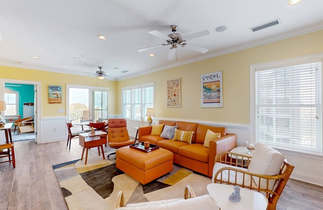 Vibrant beach retreat with washer/dryer, central AC, deck, & pool access