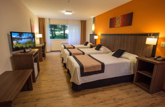 Wake to Breathtaking Garden Views Near City Center, Steps from Nahuel Huapi Lake