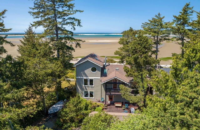 Walk to the sand and enjoy incredible views from this beach front home!