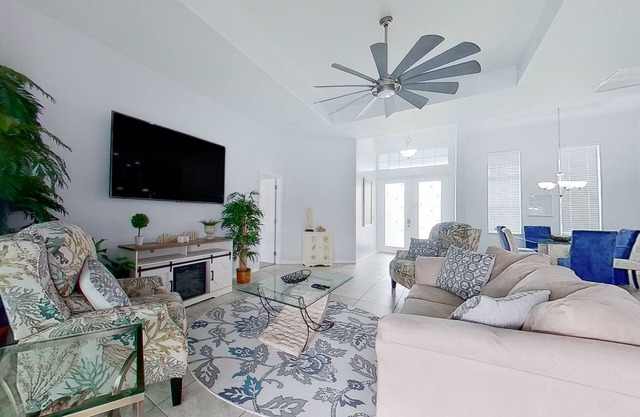 Waterfront home with private pool, dock, WiFi, central AC, and desk workspaces