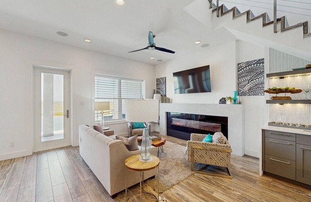 Waterfront townhome with dock, canal view & fireplaces - walk to beach