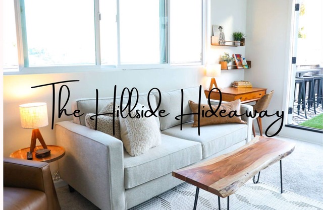 Welcome to The Hillside Hideaway! This unique rental offers two separate units, perfect for two families or couples vacationing together who want their own private space. Step inside to discover a one-of-a-kind blend of mid-century retro-chic.