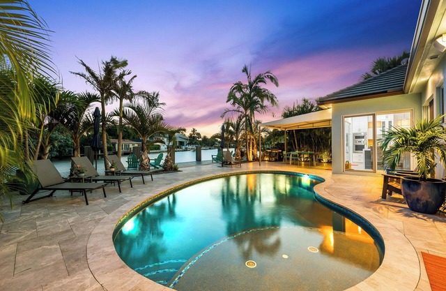 Welcome to the Bahama Breeze, A Sunny Waterfront Heated Pool Home!!!!!!
