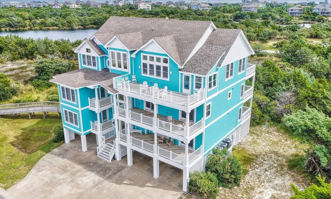 Avon Casa | 1-acre waterfront oasis with pool, hot tubs & sunrise/set views - dog-friendly