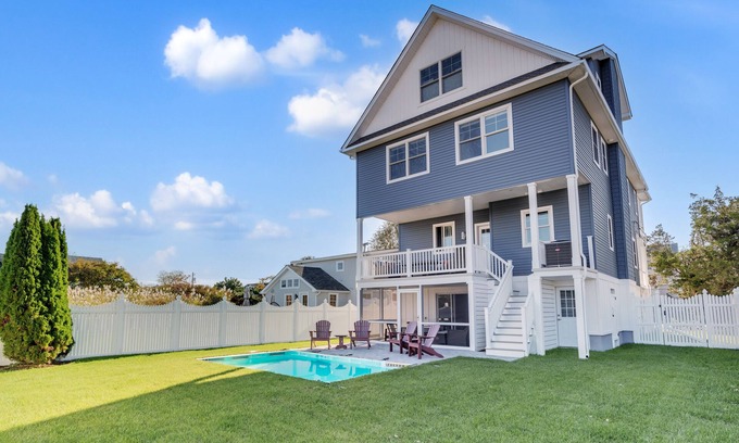 Admiral Estates Casa | 3 levels with 5 bedrooms, 4.5 baths, elevator, heated pool, and lots of gathering spaces both inside and out!