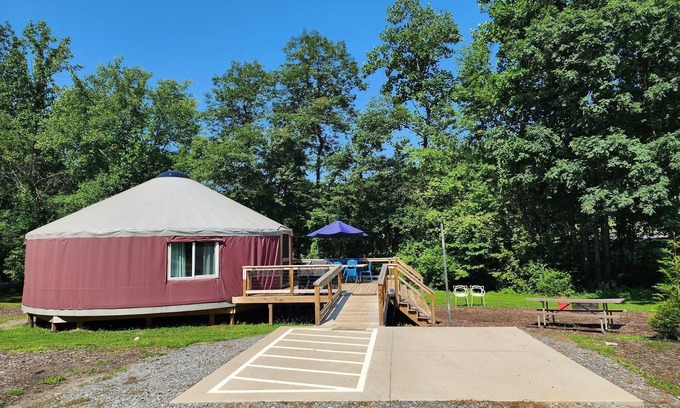 Mill Spring Casa | 30' ADA Yurt with a large deck, on the creek, full kitchen, dome skylight, dog friendly, 2 bedrooms, sleeps 5.