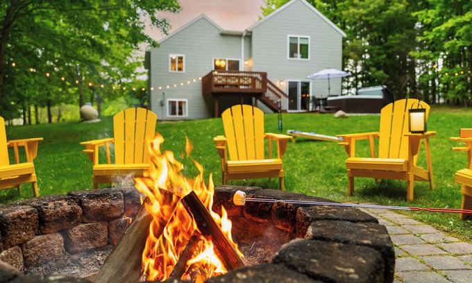 Traverse City Casa | 4bdr 2 bath house. Unwind in the hot tub, chat around the fire pit and disc golf