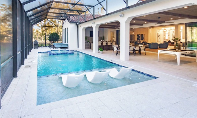 West Kissimmee Casa | 6BR+Game Room~ Pool, Fire Pit ~ Golf Course ~By Magic Kingdom~Orange Lake Resort