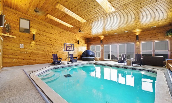 Prudenville Casa | 6BR Houghton Lake House w/ Indoor Pool, Hot Tub, and Golf Simulator - Sleeps 24
