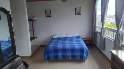Calarca Apartamento | Apartamento acogedor, 1 habitación, cocina, comedor, vista a zonas verdes, English