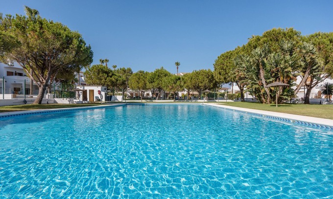Los Gallos-Cerromolino Apartamento | Apartamento 'Viento Del Mar' con piscina compartida, terraza privada y aire acondicionado.