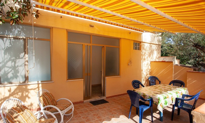 Cala Liberotto Apartamento | Apartamento Casa Azzurra con terraza y aire acondicionado
