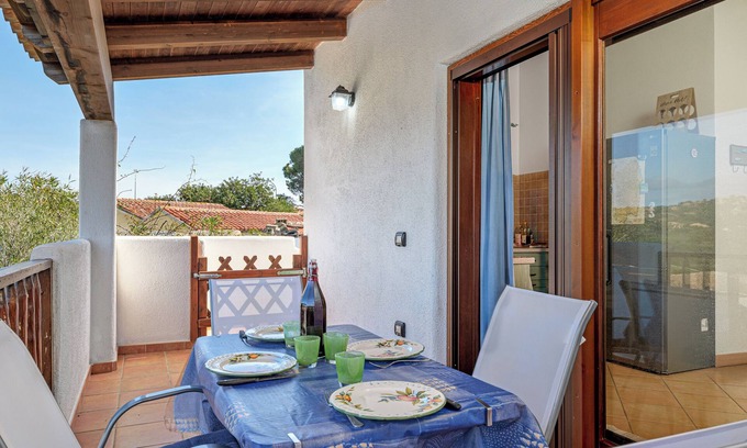 Monte Petrosu Apartamento | Apartamento 'Con Vista Porto Taverna' con vistas al mar, terraza privada y aire acondicionado.